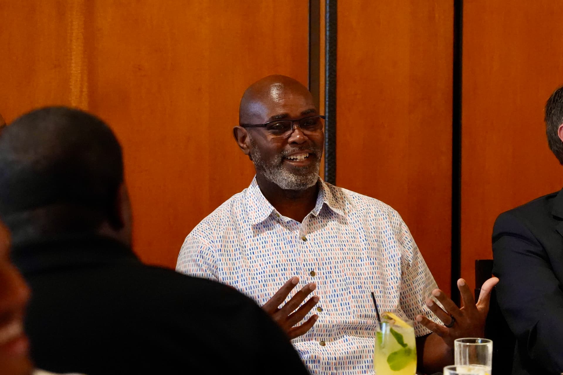 Smiling guest at a Cyber In Color gathering